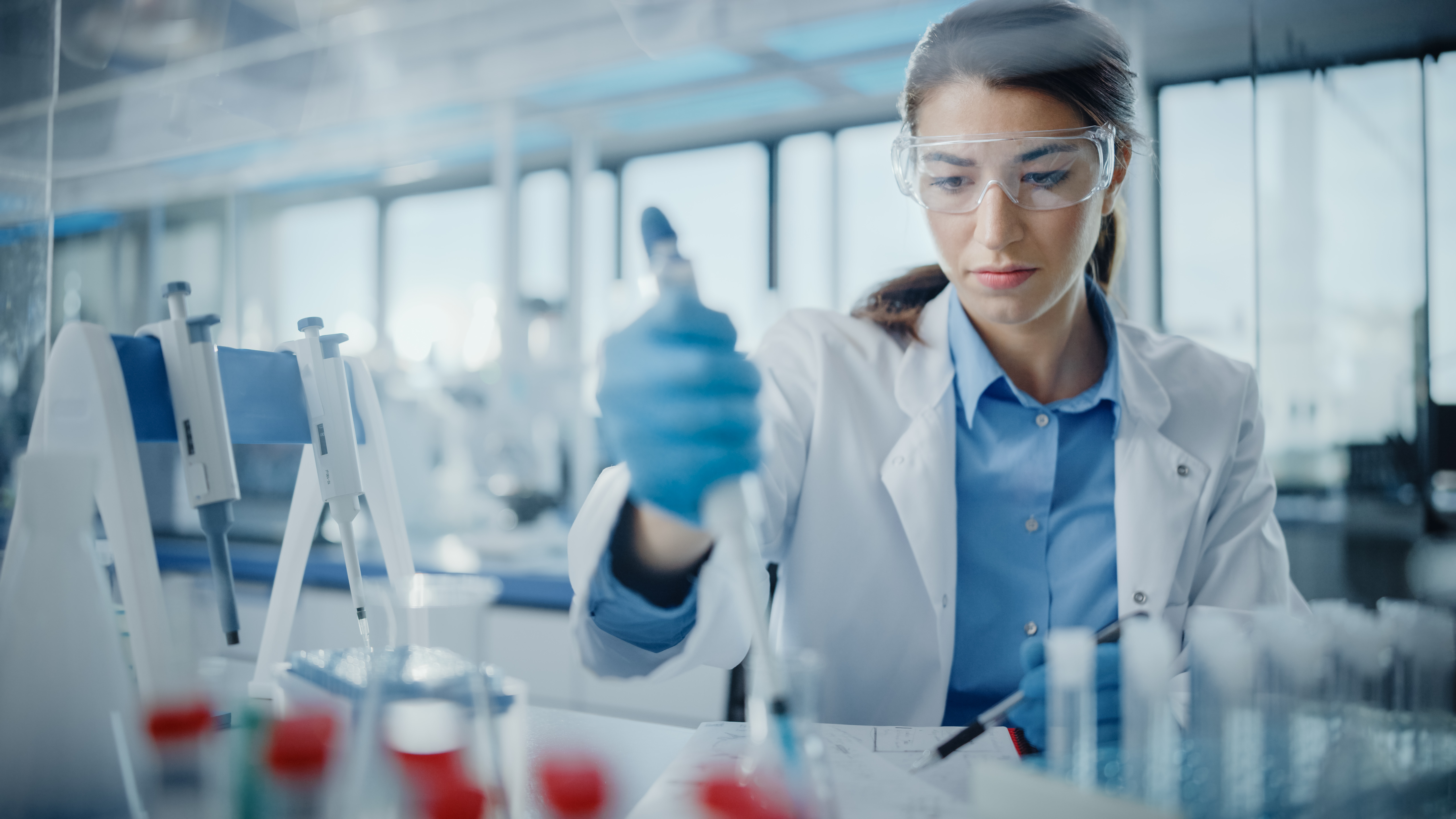 Female scientist examining sample